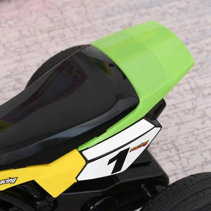 Green and black kids ride-on tricycle seat with racing number 1 decal on side