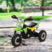 Green toddler ride-on tricycle with music and lights on a paved outdoor path