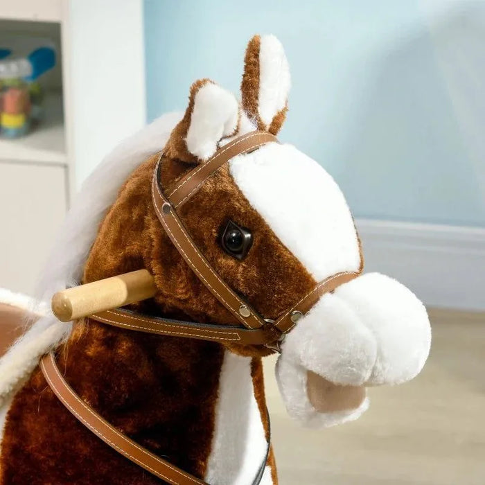 Brown and white kids rocking horse toy with cowboy theme and plush texture indoors