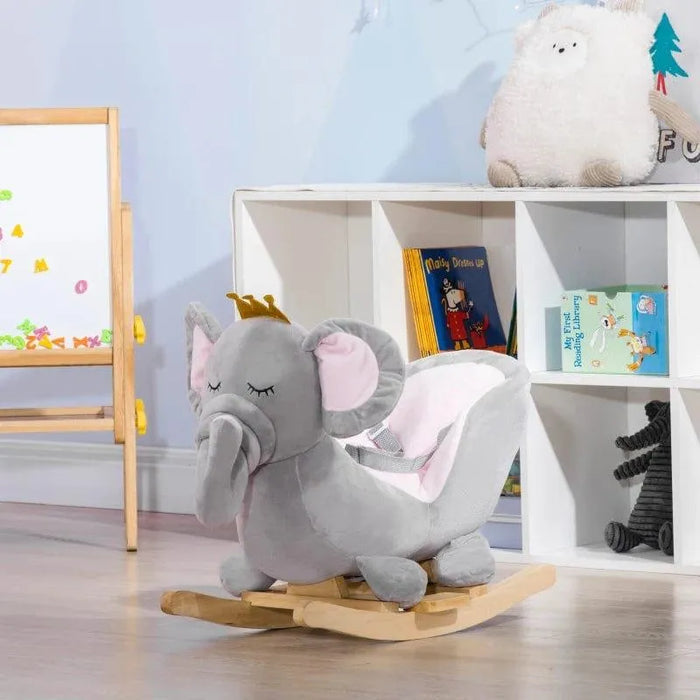 Grey elephant rocking horse toy with crown in children's playroom, books and plush decor