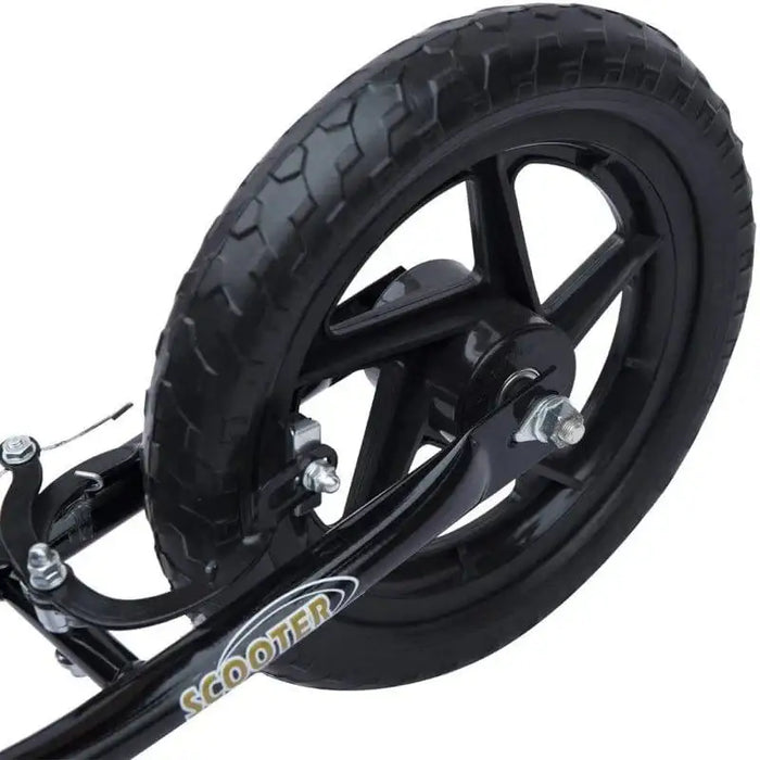 Close-up of black kids scooter rear wheel with wide deck and solid EVA tire