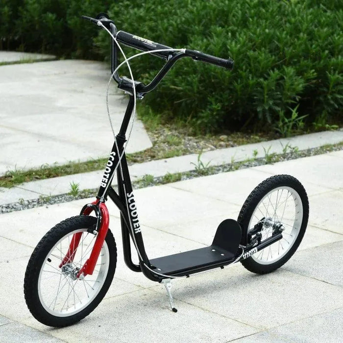 Black kids scooter with big wheels, adjustable handlebar, dual brakes, parked outdoors