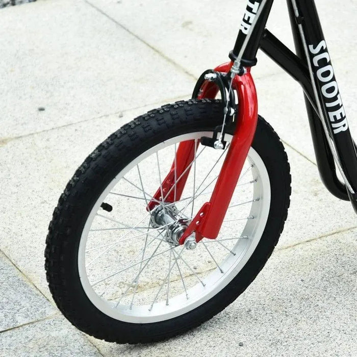 Close-up of kids scooter with big black wheel, red fork, and black frame on pavement