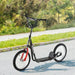 Black kids scooter with big wheels, adjustable handlebar, and dual brakes on a paved path