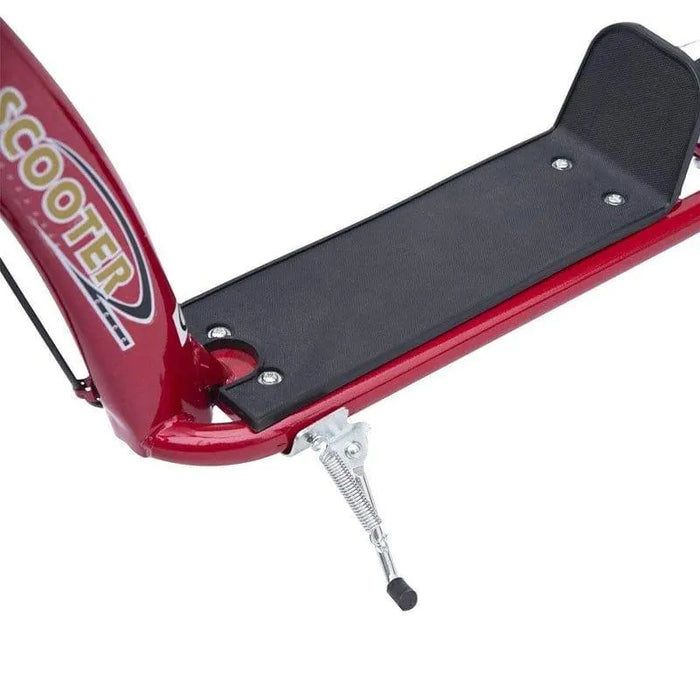 Red kids stunt scooter wide foot deck and kickstand closeup