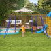 Child playing on blue and orange swing set with slide in garden playset backyard