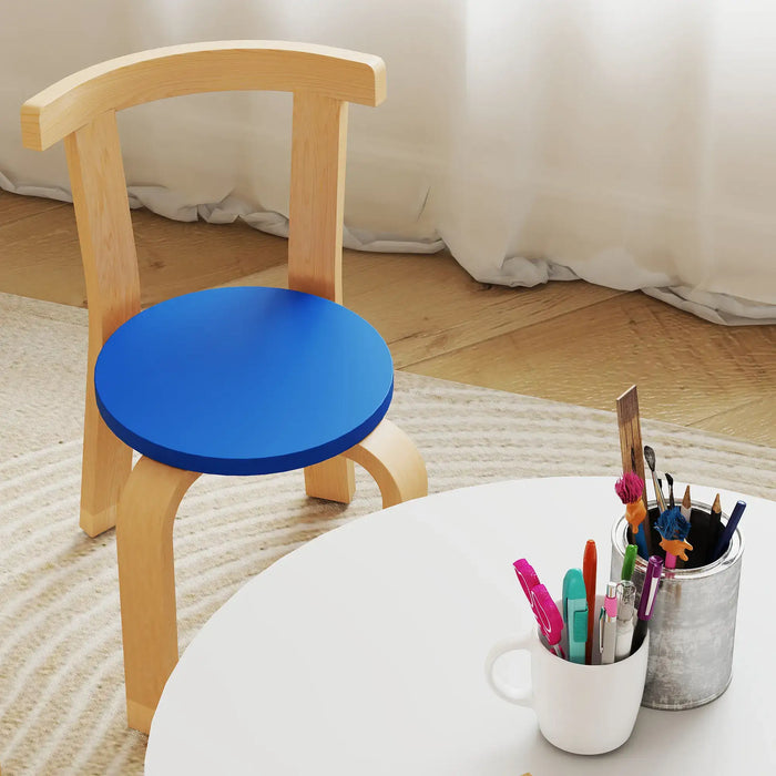 Wooden chair with a blue seat next to a table with stationery items.