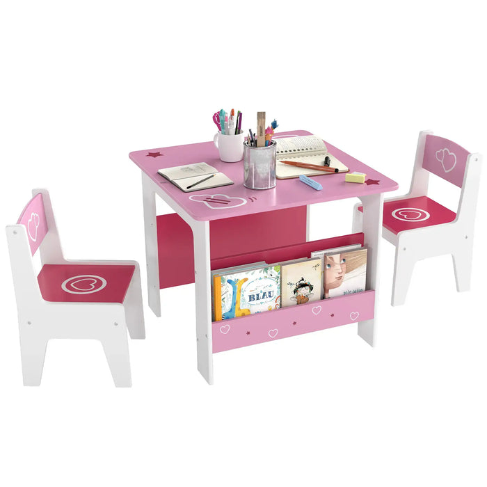 Pink and white kids table and chairs set with books, notebooks, and colorful stationery on white background