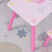 Pink kids table and chair set with princess and crown design on floral play mat