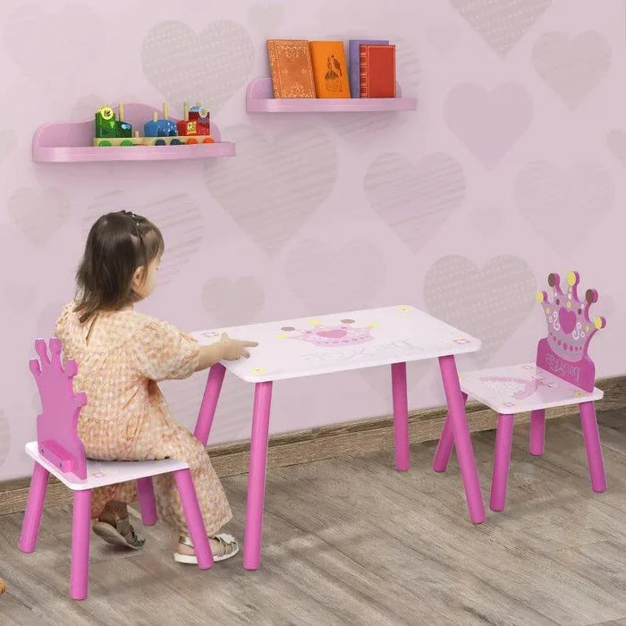 Kids pink princess table and chair set with crown-shaped backs, child sitting, heart wallpaper