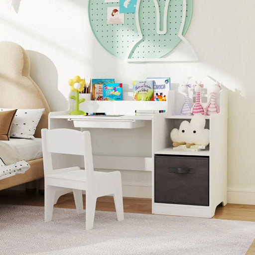 Children's desk with chair in a room setting with books and toys.