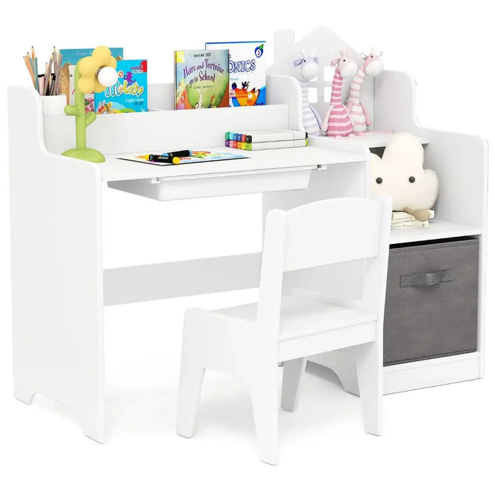 White children's desk with chair and storage bin, featuring educational materials and toys.