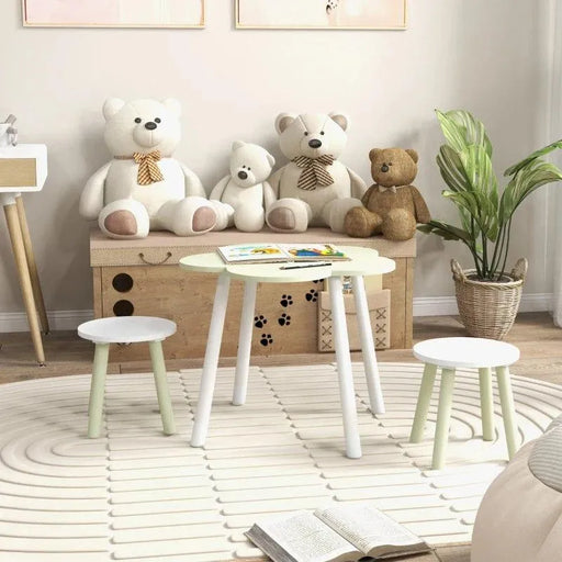 Kids green and white flower-shaped table and chairs set in cozy playroom with plush bears