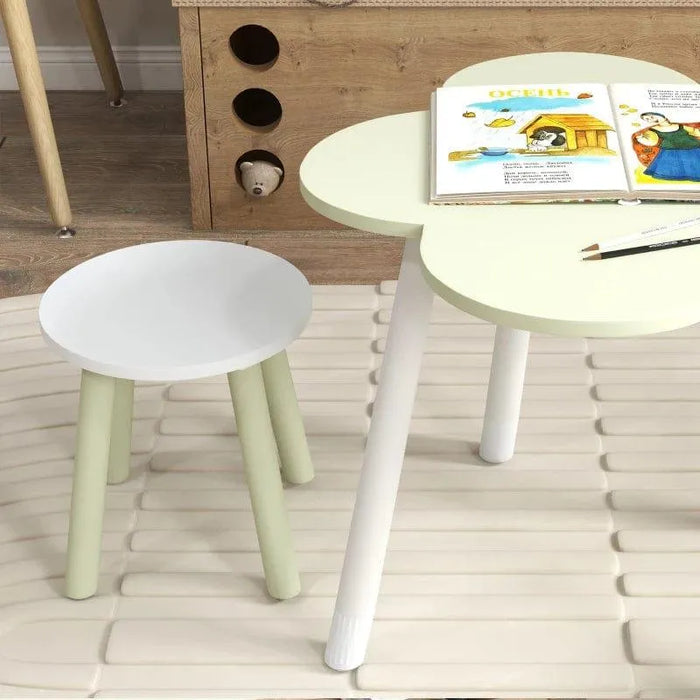 Kids table and chair set with green flower-shaped table and white round chair