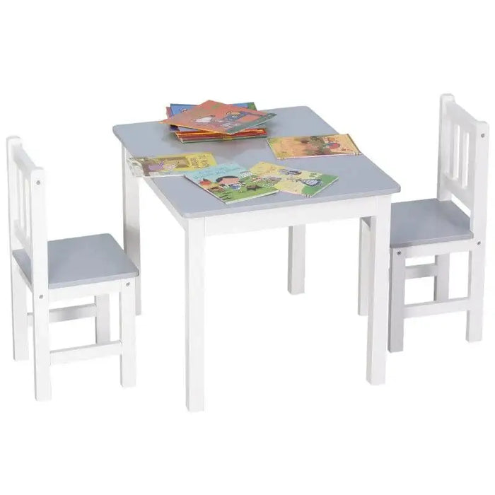 Grey and white kids table and chair set with children's books on tabletop