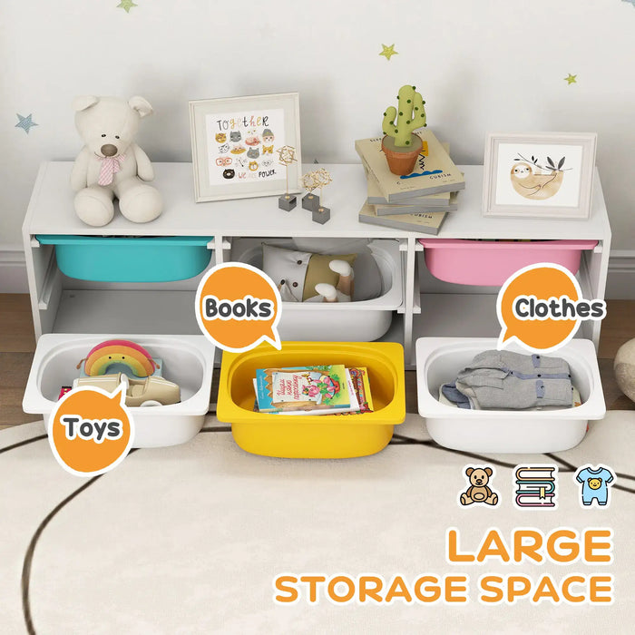 Children's storage unit with labeled sections for toys, books, and clothes on a wooden floor.