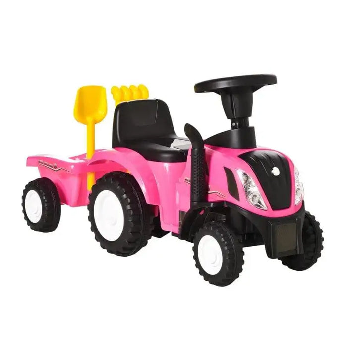 Pink kids' tractor ride-on toy with black seat, trailer, yellow shovel, and chunky wheels