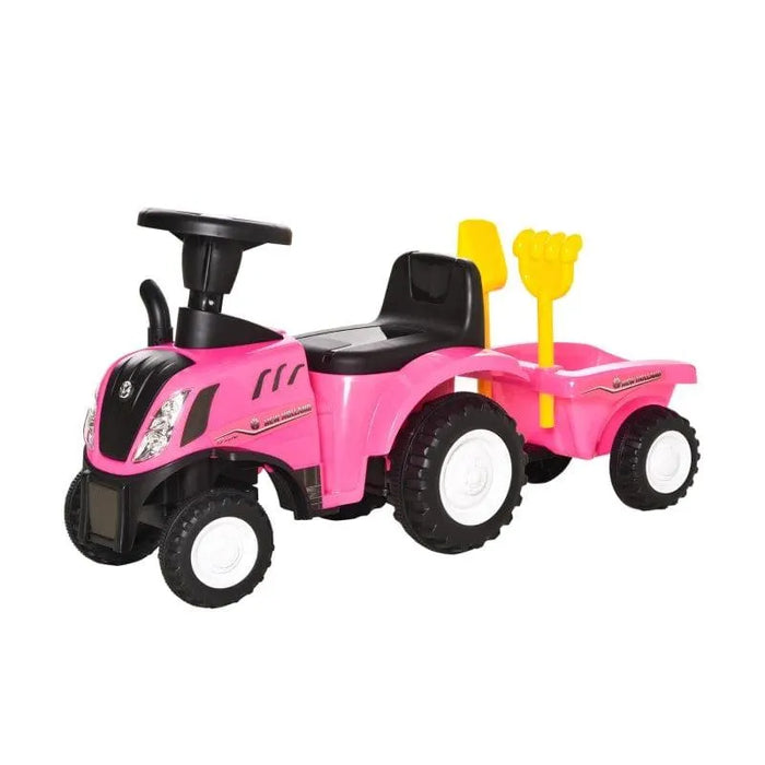 Kids pink ride-on tractor toy with trailer and yellow shovel attachment