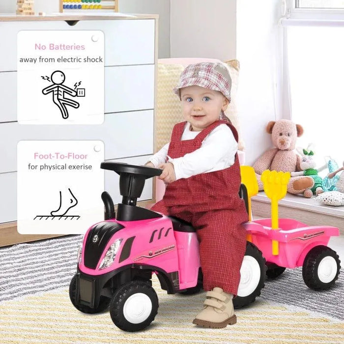 Toddler riding pink tractor ride-on toy with cargo box indoors, toy bear and dresser nearby.