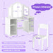 White children's desk and chair with dimensions on a purple background
