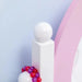 Close-up of kids vanity table in pink and white with beads, acrylic mirror visible