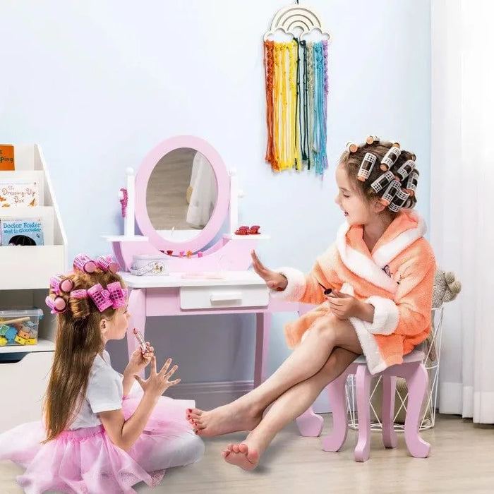 Kids playing at pink and white vanity table with stool, drawer, and acrylic mirror