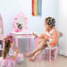 Kids pink and white vanity table with mirror, storage, and safety features, two girls playing