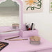Pink kids vanity table set with mirror, makeup brushes, art and flower wall decor