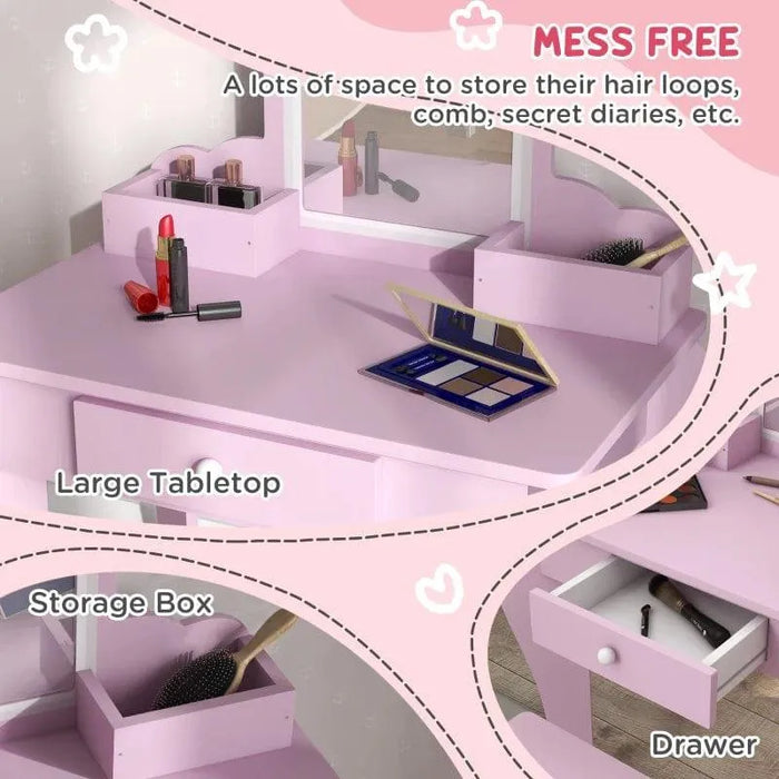 Pink kids vanity table set with mirror, storage boxes, drawer, and makeup items on tabletop.