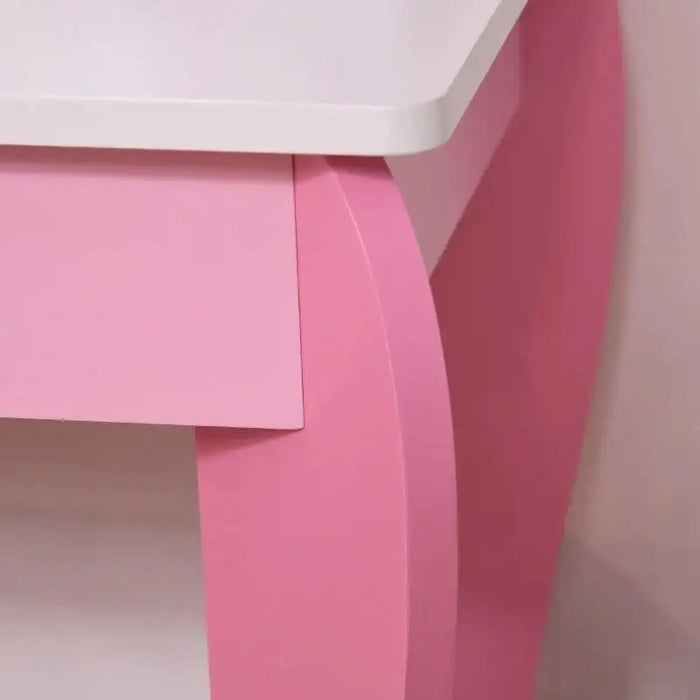 Close-up of pink kids vanity table corner with white tabletop