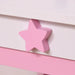 Close-up of pink star-shaped drawer handle on kids vanity table with white and pink colors.