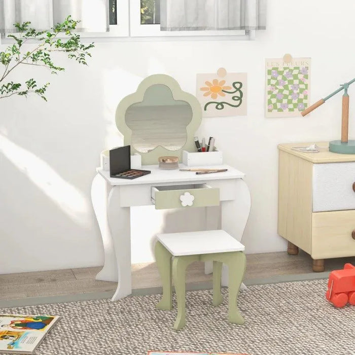 Kids white and green vanity table set with flower design, matching stool and drawer, in a playroom.