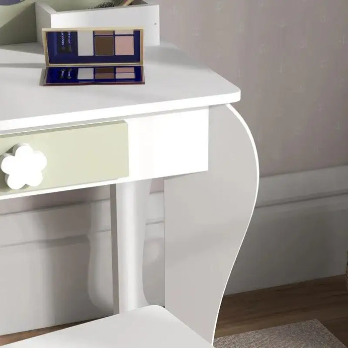 white kids vanity table with green flower drawer and palette on top