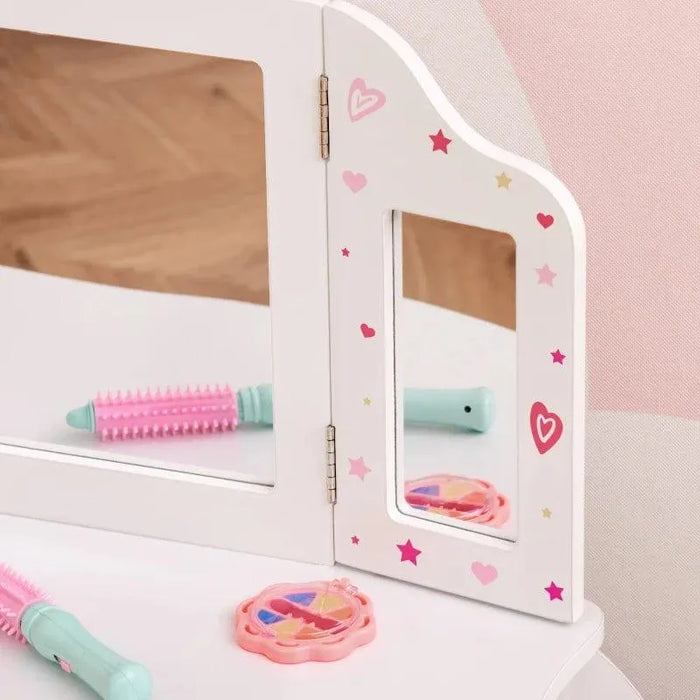 Kids white vanity table mirror with pink stars, hearts, toy brush, and makeup accessory