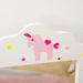 Pink unicorn and heart stickers on white kids vanity table with yellow and pink stars