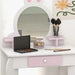 Kids white and pink vanity table with bunny mirror, makeup, brushes, and a painted flower wall art