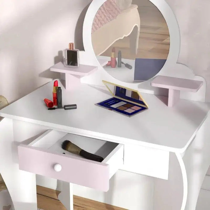 Kids white and pink vanity table with mirror, makeup, open drawer, and bunny stool.