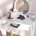 Kids white and pink vanity table with mirror, makeup, open drawer, and bunny stool.