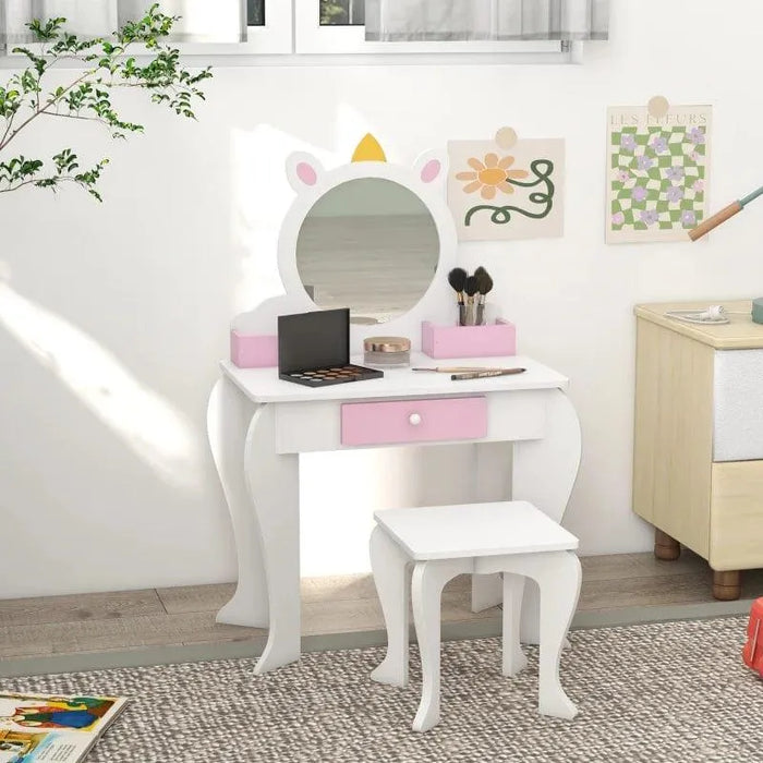 Kids unicorn vanity table with mirror, storage drawer, and matching stool in white and pink