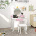 Kids unicorn vanity table with mirror, storage drawer, and matching stool in white and pink