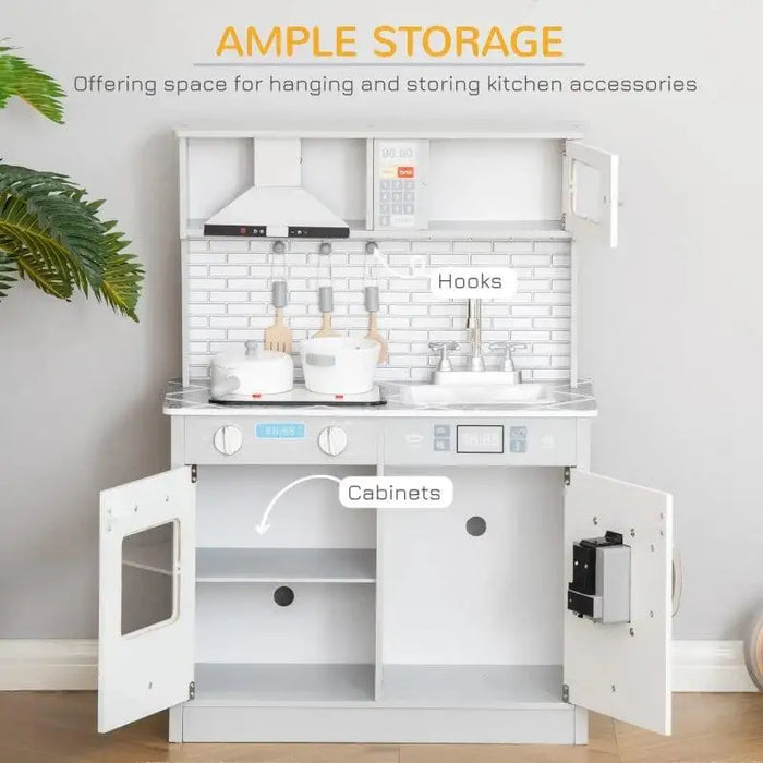 Grey and white wooden kids kitchen playset with marble countertop, hooks, and cabinets.