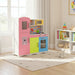 Colorful wooden play kitchen set in bright, sunlit kids room with toys and books