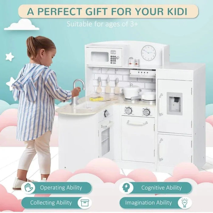 Child playing with white wooden kids kitchen playset with electronic water dispenser and accessories.