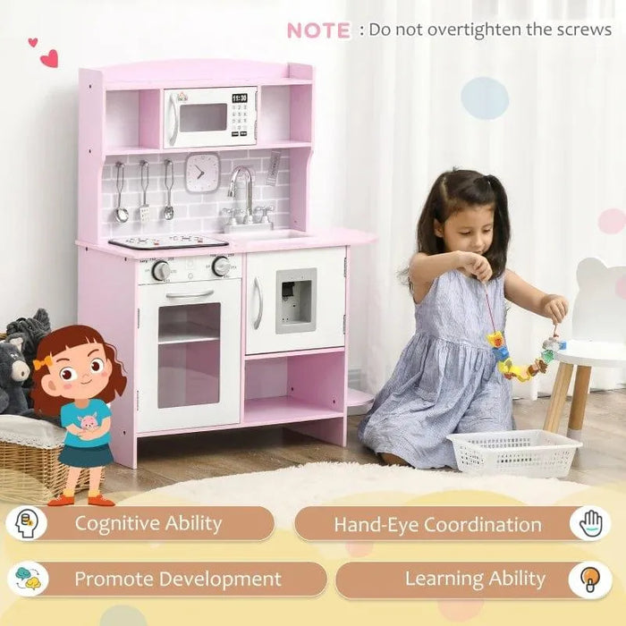 Young girl playing next to pink and white wooden kids kitchen playset with toy clock and sink
