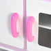 Close-up of pink handles on a white kids wooden kitchen playset cabinet door