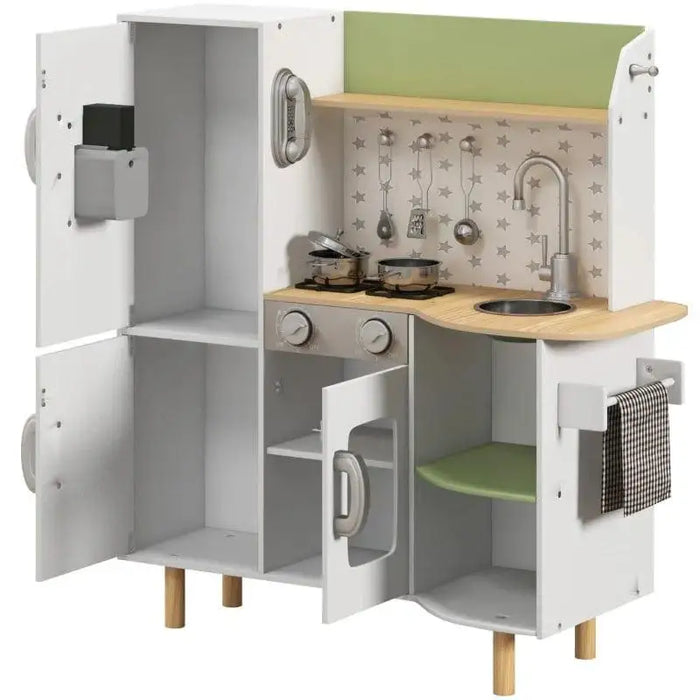 Kids wooden kitchen playset in white and green with refrigerator, stove, sink, and utensils.