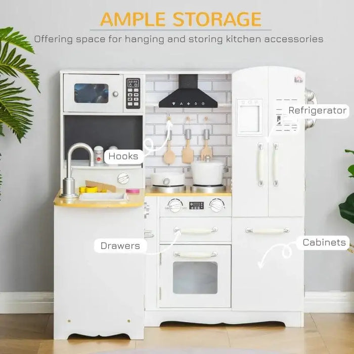 Kids white wooden kitchen playset with refrigerator, drawers, cabinets, and hanging hooks