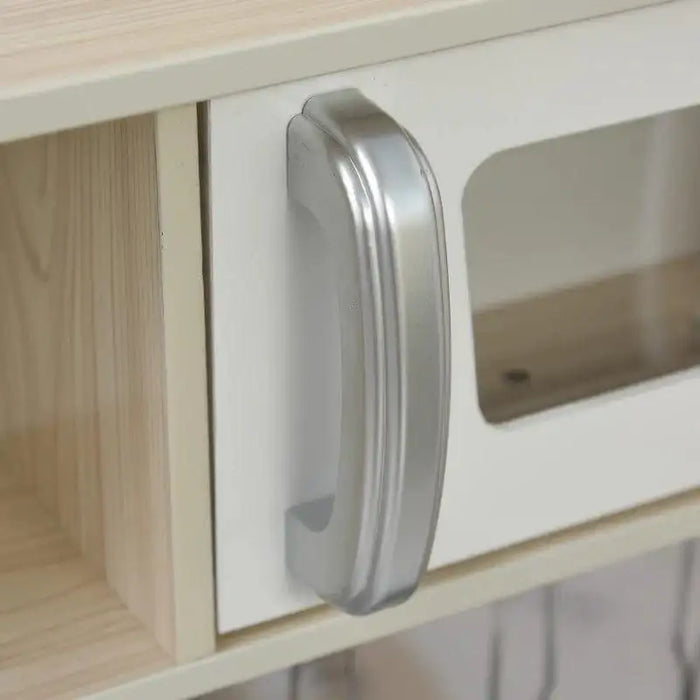 Close-up of toy kitchen playset cabinet with silver handle and wood grain finish