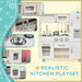 White wooden kids kitchen playset with microwave, sink, faucet, oven, and water dispenser.