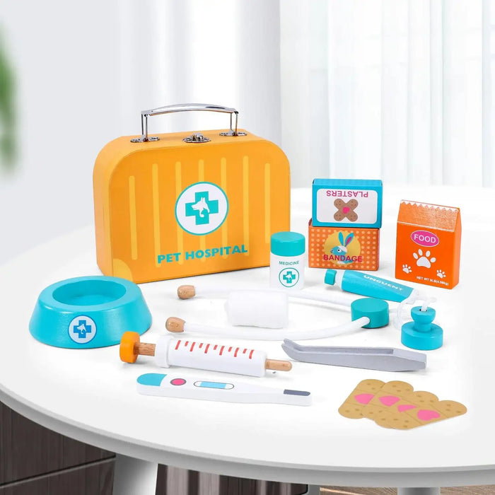 Kids wooden pet hospital veterinary kit with toy medical tools and carry case on table